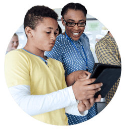 Teacher and student looking at a tablet together