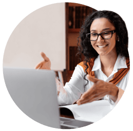 Woman gesturing to laptop