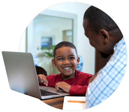 K-12 student and his father using PowerSchool Student Enrollment Management Software at home