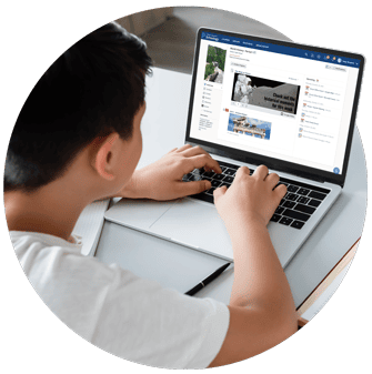 K-12 student using a laptop showing PowerSchool software, a trusted and proven education partner